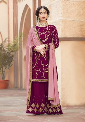 Catch All The Limelight Wearing This Designer Plazzo Suit In Magenta Pink Color Paired With Light Pink Colored Dupatta. Its Embroidered Top And Bottom Are Fabricated On Georgette Paired With Chiffon Fabricated Dupatta. Buy Now.