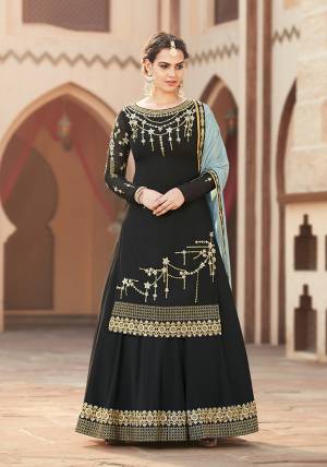 For A Bold And Beautiful Look, Grab This Designer Indo-Western Suit In Black Color Paired With A Pretty Sky Blue Colored Dupatta. Its Top And Bottom Are Georgette Based Paired With Chiffon Fabricated Dupatta. Buy Now. 