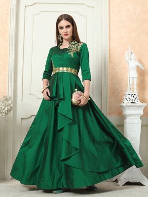 Here Is An Easy Go Designer Readymade Gown In Dark Green Color Fabricated On Tafeta Art Silk. It Is Beautified With Embroidery Over Yoke And Has A Very Pretty Double Layered Pattern. Buy Now.