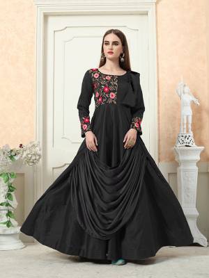 Grab This Beautiful Designer Readymade Gown In Black Color For The Upcoming Festive And Wedding Season. This Pretty Gown Is Fabricated On Tafeta Art Silk Beautified With A Drape Pattern And Attractive Embroidery Work. 