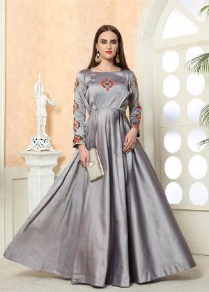 Celebrate This Festive Season with Beauty And Comfort Wearing This Designer Light Weight Readymade Gown In Grey Color. This Silk based Gown Is Beautified With contrasting Embroidery Over the Yoke And Sleeves. Buy Now.