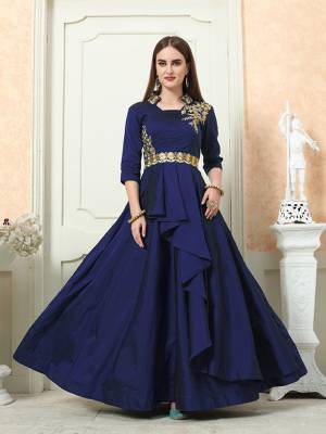 Here Is An Easy Go Designer Readymade Gown In Navy Blue Color Fabricated On Tafeta Art Silk. It Is Beautified With Embroidery Over Yoke And Has A Very Pretty Double Layered Pattern. Buy Now.