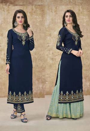 Go With The Pretty Shades Of Blue With This Designer Suit In Navy Blue Colored Top And Bottom Paired With Another Sky Blue Colored Bottom And Dupatta. Its Pretty Embroidered Top Is Fabricated On Satin Georgette With An Embroidered Santoon Bottom. Its Another Bottom Is Fabricated On Banarasi Jacquard Paired With Chiffon Fabricated Dupatta. 