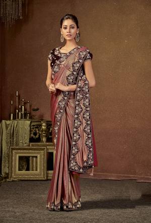 Enhanced with half-pearl details , this pre-pleated metallic feel saree is an exquisite pick for festive affairs. 