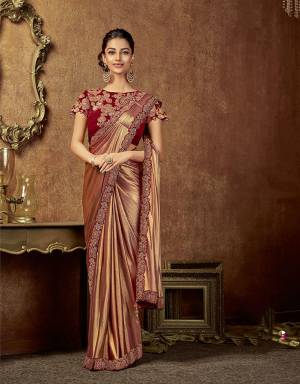 If your style is all about Glamour with a bit of convention, this metallic hued saree is a choicest pick . 