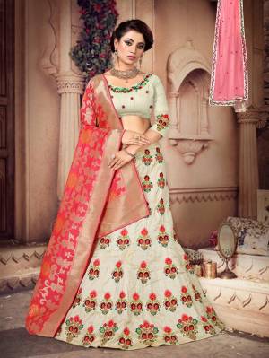 Here Is a Proper Indian Traditional Look With This Beautiful Designer Lehenga Choli. This Designer Lehenga Choli IS Silk Based Paired With Jacquard Silk Fabricated Dupatta And It Has Another Dupatta Fabricated On Net. It Is Beautified With Contrasting Heavy Embroidery Over Blouse And Lehenga Giving It A More Attractive Look.