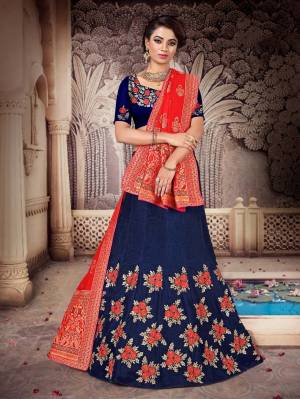 You Will Definitely Earn Lots Of Compliments Wearing This Heavy Designer Lehenga Which Has Two Dupatta Concept. This Heavy Embroidered Lehenga Choli Is Silk Based Paired With One Jacquard Silk Dupatta And Another Net Fabricated Dupatta. All Its Fabrics And Color Pallete Will Also Give A Rich Look To Your Personality.