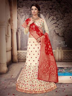 Here Is a Proper Indian Traditional Look With This Beautiful Designer Lehenga Choli. This Designer Lehenga Choli IS Silk Based Paired With Jacquard Silk Fabricated Dupatta And It Has Another Dupatta Fabricated On Net. It Is Beautified With Contrasting Heavy Embroidery Over Blouse And Lehenga Giving It A More Attractive Look.