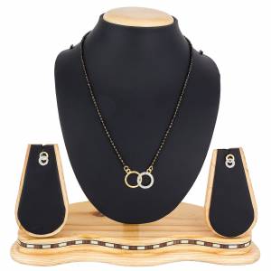 Rich And Elegant Looking Delicate Patterned Mangalsutra Set Is Here In Golden Color. This Pretty Set Can Be Paired With Any Colored Attire. Buy Now.