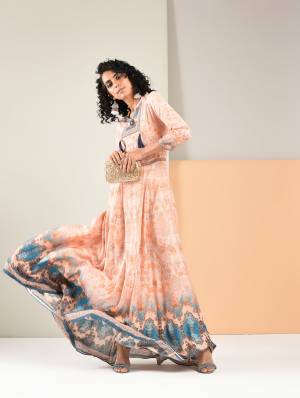 Grab This Designer Readymade Gown In Light Peach Color Fabricated On Rayon. This Pretty Gown Is Beautified With Prints And Also It Is Light In Weight And Easy To Carry All Day Long. 