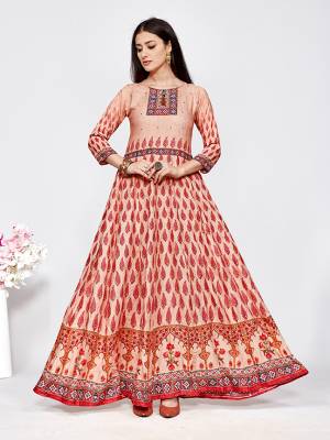 Celebrate This Festive Season With Beauty And Comfort Wearing This Designer Readymade Floor Length Gown In Red And Cream Color Fabricated On Rayon. It Is Light In Weight And Easy To Carry All Day Long. 