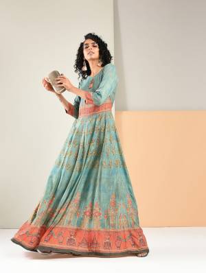 Flaunt Your Rich And Elegant Taste Wearing This Designer Readymade Gown In Light Blue Color Fabricated On Rayon. It Has Pretty Prints All Over It. Buy Now.