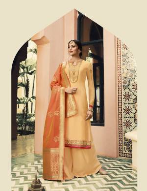 Shine Bright In This Designer Semi-Stitched Suit In Attractive Shades Or Orange. Its Top IS Satin Georgette Based Beautified With Embroidery Paired With Santoon Bottom And Banarasi Art Silk Fabricated Dupatta. 