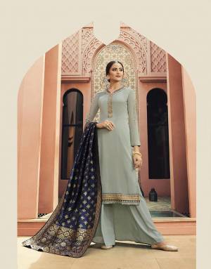 Flaunt Your Rich And Elegant Taste Wearing This Unique Color Pallete With This Designer Suit In Steel Blue Color Paired With Navy Blue Colored Dupatta. Its Top Is Satin Georgette Based Paired With Santoon Bottom And Banarasi Art Silk Dupatta. All Its Fabrics Ensures Superb Comfort All Day Long. 