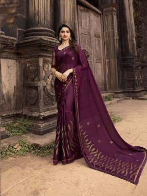 Must Have Shade In Every Womens Wardrobe Is Here With This Designer Saree In Wine Color Paired With Wine Colored Blouse. This Saree Is Fabricated On Georgette Paired With Jacquard And Art Silk Blouse. Buy This Designer Foil Printed Saree Now.