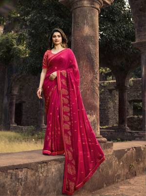 Catch All The Limelight Wearing This Designer Foil Printed Saree In Rani Pink Color Paired With Rani Pink colored Blouse. This Saree Is Fabricated On Georgette Beautified With Foil Prints Paired With Jacquard And Art Silk Fabricated Blouse. 