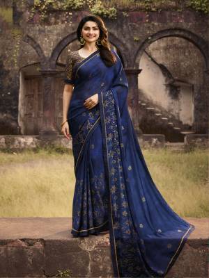 Bright And Visually Appealing Color Is Here With This Designer Saree In Royal Blue Color. This Saree Is Fabricated On Georgette Beautified With Foil Prints Paired With Jacquard And Art Silk Fabricated Blouse. 