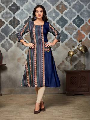 New And Unique Print Patterned Designer Readymade Kurti Is Here In Blue And Multi Color Fabricated On Rayon. It Is Soft Towards Skin And Easy To Carry All Day Long. 