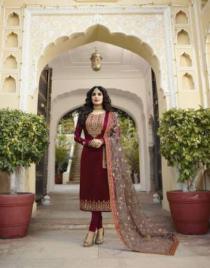 Grab This Designer Heavy Embroidered Suit In Magenta Pink Colored Top And Bottom Paired With Contrasting Grey Colored Dupatta. Its Top And Dupatta Are Beautified With Heavy Embroidery. Its Top Is Fabricated On Satin Georgette Paired With Santoon Bottom And Net Fabricated Dupatta. Buy This Semi-Stitched Suit Now.