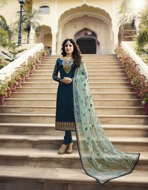 Go With The Shades Of Blue With This Designer Heavy Embroidered Suit In Blue Color Paired With Aqua Blue Colored Dupatta. Its Embroidered Top Is Fabricated On Satin Georgette Paired With Santoon Bottom And Its Heavy Embroidered Dupatta Is Fabricated On Net. 