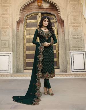 Catch All The Limelight Wearing This Heavy Designer Straight Suit In All Over Dark Green Color. Its Top Is Satin Georgette Based Paired With Santoon Bottom And Georgette Fabricated Embroidered Dupatta. 