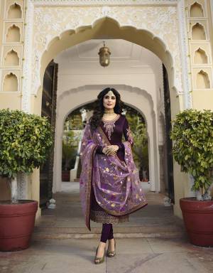 Bright And Visually Appealing Color Pallete Of Purple Is Here With This Designer Straight Suit. Its Top And Bottom Are In Dark Purple Color Paired With Lavendor Colored Dupatta. Its Top Is Fabricated On Satin Georgette Paired With Santoon Bottom And Net Fabricated Dupatta. Its Attractive Color Pallete And Embroidery Will Earn You Lots Of Compliments From Onlookers. 