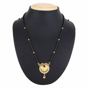 Here Is A Royal And Elegant Looking Magalsutra With A Pretty Delicate Chain And Heavy Golden Colored Pendant. This Mangalsutra Is Light In Weight And Can Be Paired With Any Colored Attire. Buy Now.