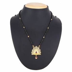 Here Is A Royal And Elegant Looking Magalsutra With A Pretty Delicate Chain And Heavy Golden Colored Pendant. This Mangalsutra Is Light In Weight And Can Be Paired With Any Colored Attire. Buy Now.