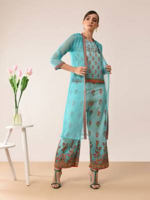 Here Is A Very Pretty Designer Indo-Western Three Piece Set. Its Top And Bottom Are In Blue Color Paired With Blue Colored Jacket. It Is Fabricated On Muslin Beautified With Prints All Over Paired With Orgenza Fabricated Jacket. Buy Now.