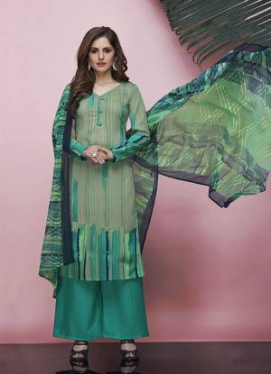 Go with The Shades Of Green With This Printed Dress Material In Pastel Green Colored Top Paired With Sea Green Colored Bottom And Green Colored Dupatta. This Dress Material Is Fabricated On American Crepe Paired With Chiffon Fabricated Dupatta. Its Fabrics Are Soft Towards Skin And Easy To Carry All Day Long.