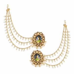 Here Is A Very Unqiue Styled Earrings Which Is In Great Trend. Grab This Golden Colored Heavy Earring Which Has To Be Tucked Over The Back Side Hair. It Is Beautified With Pearls & Stone Work.