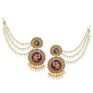Here Is A Very Unqiue Styled Earrings Which Is In Great Trend. Grab This Golden Colored Heavy Earring Which Has To Be Tucked Over The Back Side Hair. It Is Beautified With Pearls & Stone Work.