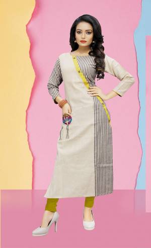Rich And Elegant Looking Designer Readymade Kurti Is Here In Off-White And Grey Colot. It Is Cotton Based Beautified With Stripes And Embroidery. 