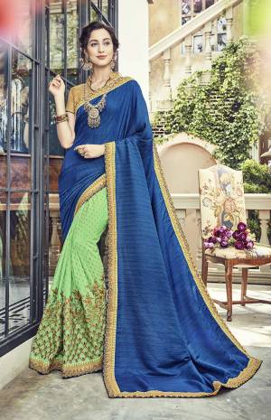 Go Colorful With This Designer Saree In Blue And Light Green Color Paired With Beige Colored Blouse. This Saree And Blouse Are Silk Based Beautified With Foil Prints And Attractive Embroidery.