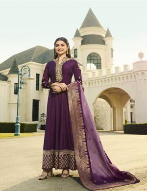 Catch All The Limelight Wearing This Designer Floor Length Suit In Purple Color. Its Top Is Silk Based Paired With Santoon Bottom And Banarasi Art Silk Fabricated Dupatta. Its Neckline , Sleeves And Suit Panel Are Beautified With Attractive Embroidery. Buy Now.