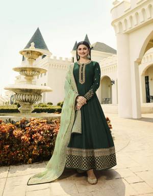 Go With The Shades Of Blue With This Designer Floor Length Suit In Dark Green Color Paired With Pastel Green Colored Dupatta. Its Pretty Embroidered Top Is Fabricated On Soft Art Silk Paired With Santoon Bottom And  Georgette Fabricated Embroidered Dupatta.