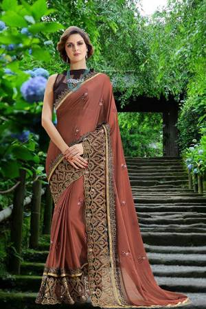 Flaunt Your Rich And Elegant Taste Wearing This Designer Saree In Light Brown Color Paired With Black Colored Blouse. This Saree Is Chiffon Based Paired With Art Silk Fabricated Blouse. It Is Easy To Drape And Carry All Day Long. 