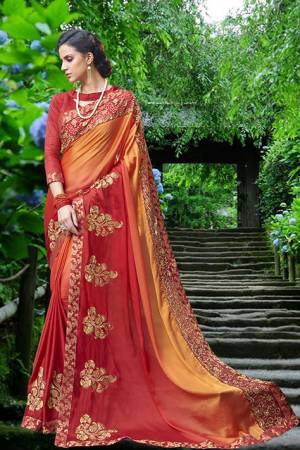 Orange And Red Color Induces Perfect Summery Appeal To Any Outfit, So Grab This saree In Orange And Red Color Paired With Red Colored Blouse. This Saree Is Fabricated On Satin Silk Paired With Art Silk Fabricated Blouse. It Has Heavy Embroidery Which Will Earn You Lots Of Compliments From Onlookers. 
