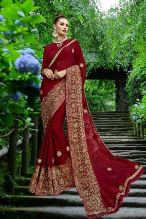 For an Enhanced Royal Look, Grab This Designer Saree In Maroon Color Paired With Maroon Colored Blouse. This Georgette Based Saree Is Piared With Art Silk Fabricated Blouse. Buy Now.