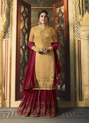 Celebrate This Festive Season Wearing This Designer Sharara Suit In Musturd Yellow Colored Top Paired With Contrasting Dark Pink Colored Bottom And Dupatta. Its Top Is Fabricated On Satin Georgette Paired With Georgette Bottom And Dupatta. Buy Now.