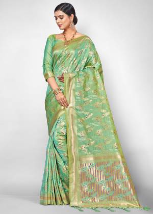 Look Pretty In This Designer Silk Based Saree Beautified With Heavy Weave All Over. Its Rich Fabric And Attractive Weave Will Earn You Lots Of Compliments From Onlookers
