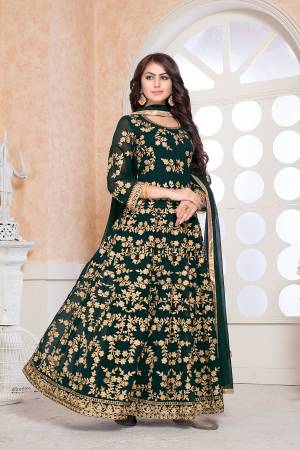 Grab This Heavy Designer Floor Length Suit For The Upcoming Festive And Wedding Season In This Pretty Dark Green Color. Its Heavy Embroidered Top Is Fabricated On Faux Georgette Paired With Santoon Bottom And Chiffon Fabricated Dupatta. Buy Now.