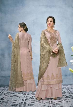 You Will Definitely Earn Lots Of Compliments In This English Color Pallete Designer Suit With Dusty Pink Colored Top And Bottom Paired With Contrasting Olive Green Colored Dupatta. Its Top Is Fabricated On Banarasi Jacquard Silk Paired With Santoon Bottom And Net Fabricated Dupatta. Buy This Rich Designer Suit Now.
