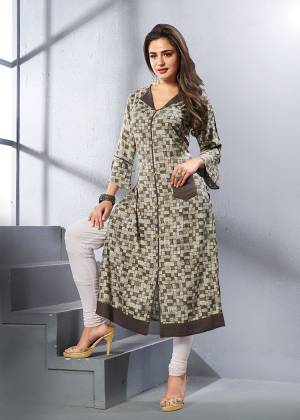 Here Is Checks Printed Readymade Kurti In Grey And Brown Color Fabricated On Rayon. It Is Beautified With Small Checks All Over It. 