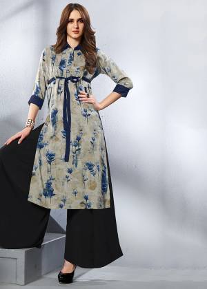 This Formal Looking Kurti Is Perfect For Your Office Wear In Grey Color. It Is Fabricated On Rayon And Can Be Paired With Leegings, Pants Or Plaazo. 