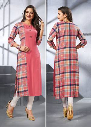 Add This Pretty Designer Readymade Kurti To Your Wardrobe In Dark Peach Color. This Kurti Is Fabricated On Rayon Beautified With Checks Prints. Buy Now.