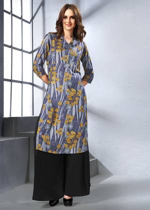 Unique Print Pattern Is Here With This Readymade Kurti In Dark Grey Color Fabricated On Rayon. It Is Beautified With Abstract And Floral Prints. Buy Now.