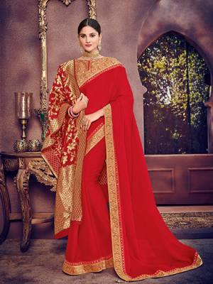 Wear this red color bright georgette saree. Ideal for party, festive & social gatherings. this gorgeous saree featuring a beautiful mix of designs. Its attractive color and heavy designer silk saree, stone design, beautiful floral design Saree along with silk jacquard dupatta work over the attire & contrast hemline adds to the look. Comes along with a contrast unstitched blouse.