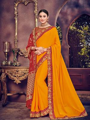 Vibrant and visually appealing, this Musturd Yellow color bright georgette saree. Ideal for party, festive & social gatherings. this gorgeous saree featuring a beautiful mix of designs. Its attractive color and heavy designer silk saree, stone design, beautiful floral design Saree along with silk jacquard dupatta work over the attire & contrast hemline adds to the look. Comes along with a contrast unstitched blouse.
