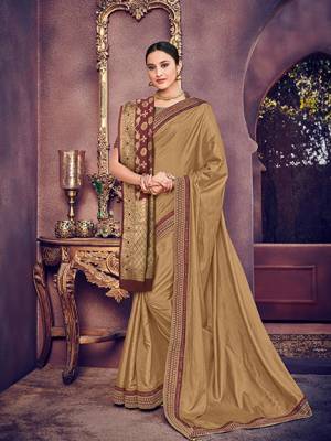You Look elegant and stylish this festive season by draping this beige color two tone silk fabrics saree. Ideal for party, festive & social gatherings. this gorgeous saree featuring a beautiful mix of designs. Its attractive color and heavy designer silk saree, stone design, beautiful floral design Saree along with silk jacquard dupatta work over the attire & contrast hemline adds to the look. Comes along with a contrast unstitched blouse.